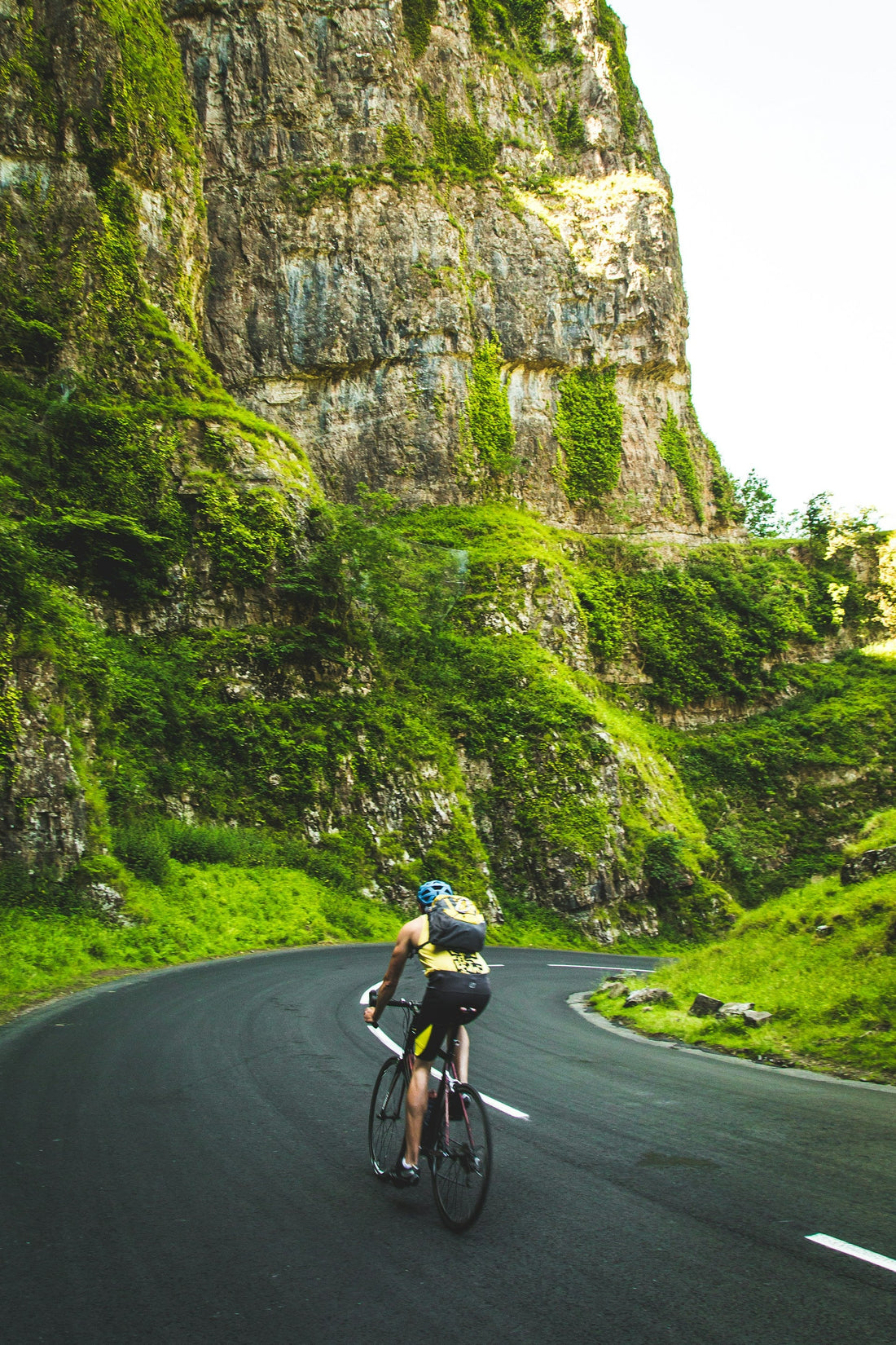 A man riding a road bike through the mountains