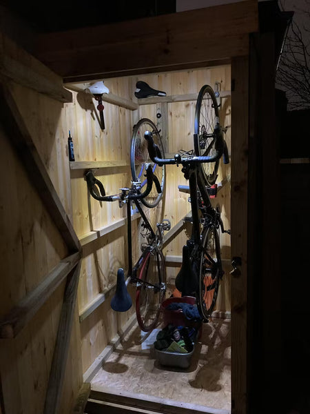 bike wall hanger in a shed