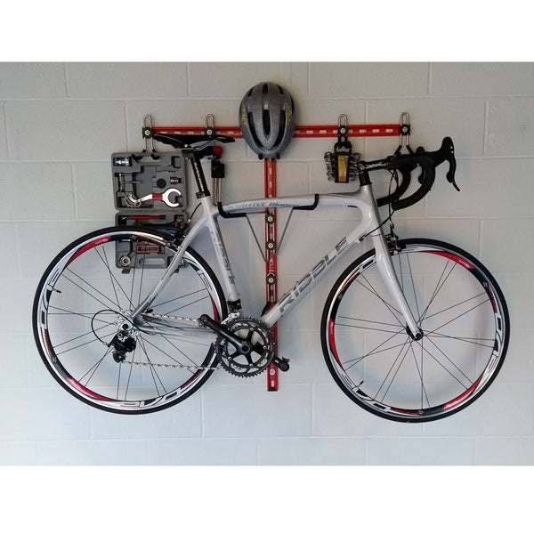 Horizontal bike rack, wall mounted bike storage with a road bike, helmet and tools