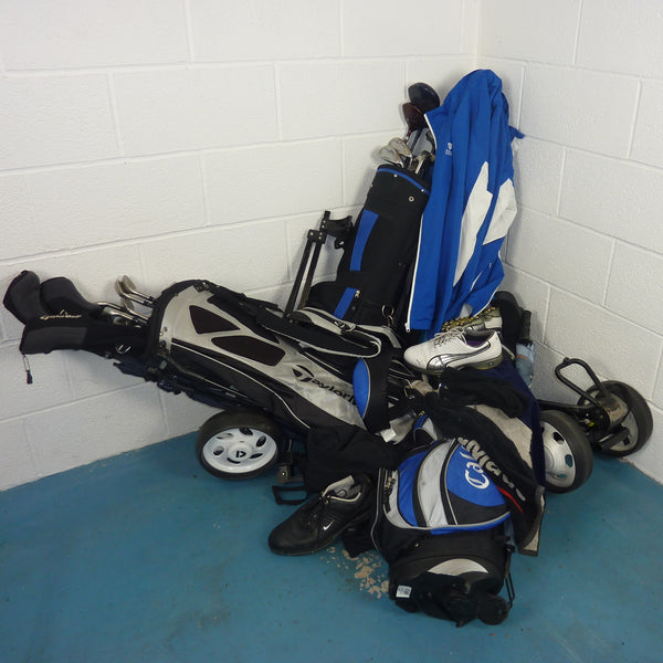 Pile of golf equipment in need of a GearHooks golf organiser rack