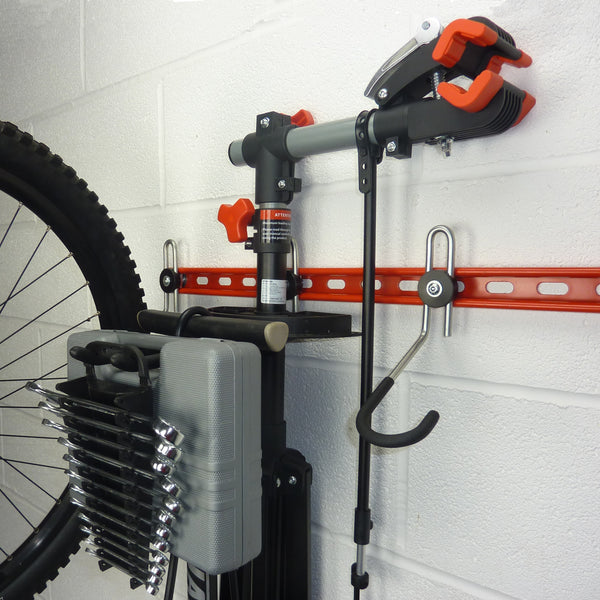 300mm long storage hook for workstand, pump, and tools mounted between the bikes on a Wall mounted bike rack 