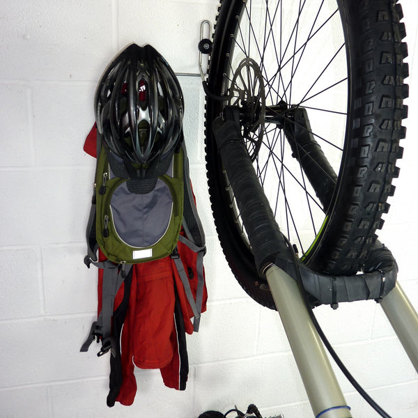 Bike hanger for 1 bike plus helmet, backpack and coat shown with a mountain bike, backpack, coat and helmet