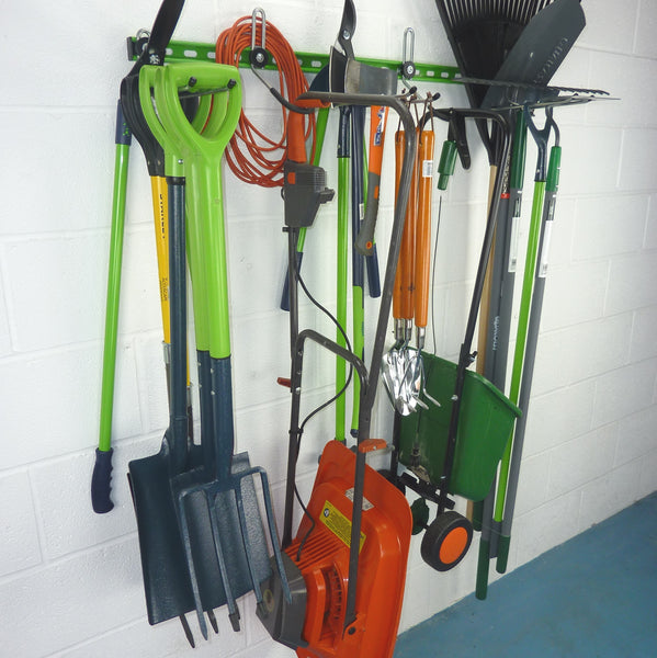 Garden tool rack for 25+ tools holding spades, shovels, fork, lawn edger, hoe, shears, rakes, lawn mower and seed spreader